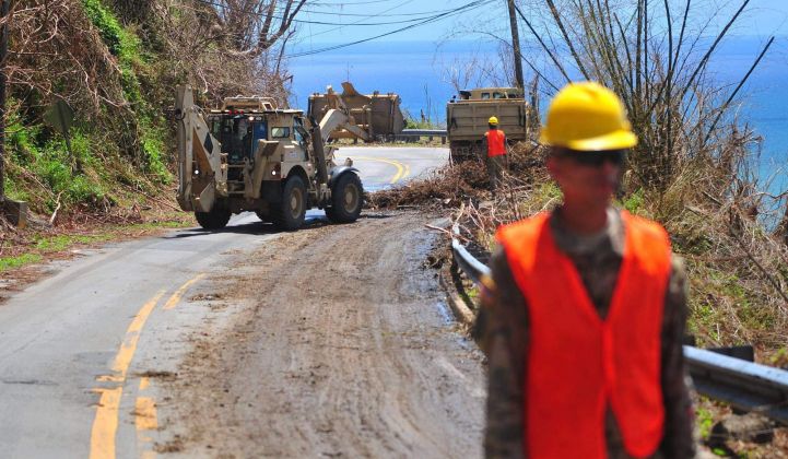 Post-Maria, the Puerto Rico National Guard clears debris from a road in Yabucoa.